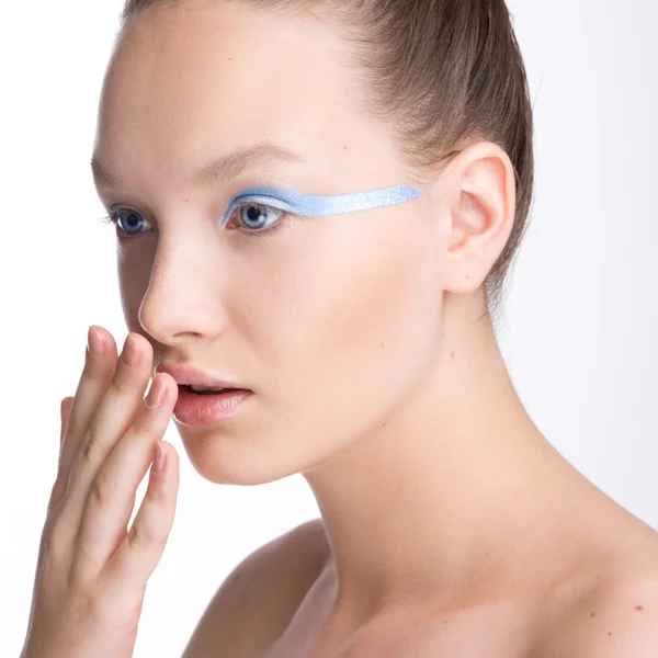 Young female model with unusual silver make up on a white isolated background. Beauty model at the studio — Stock Photo, Image