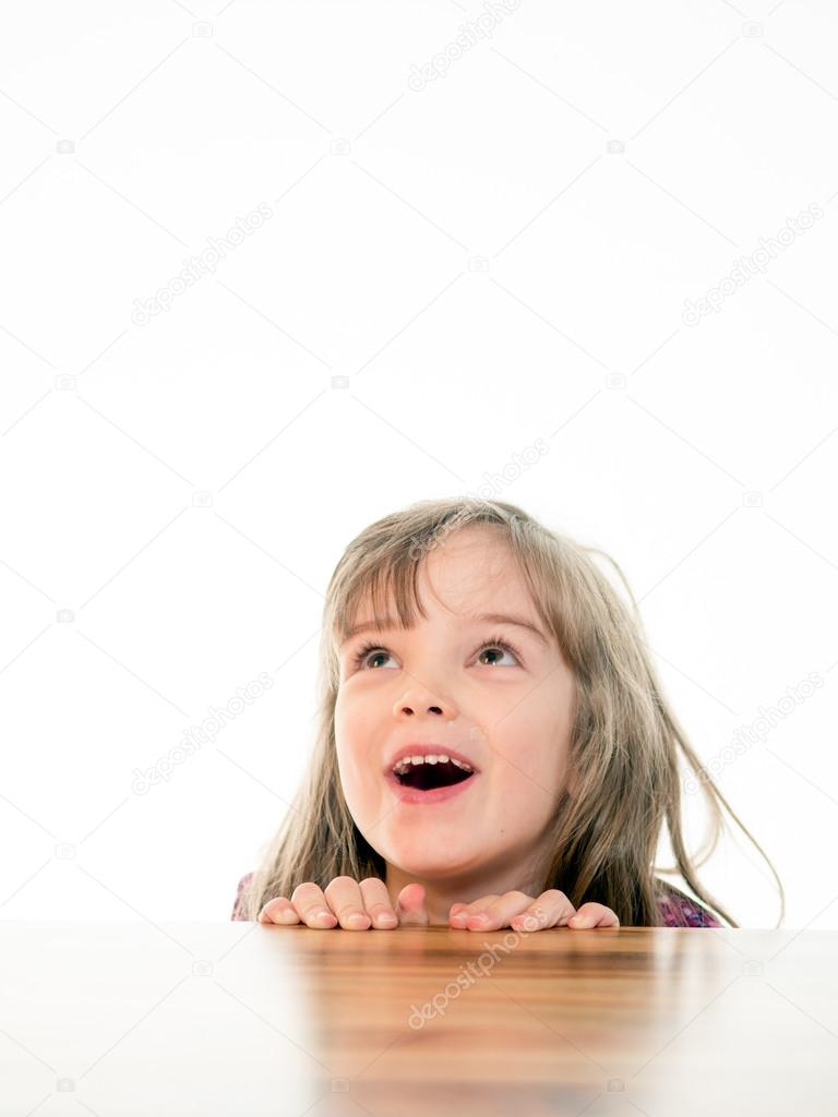 Child looking up with open mouth
