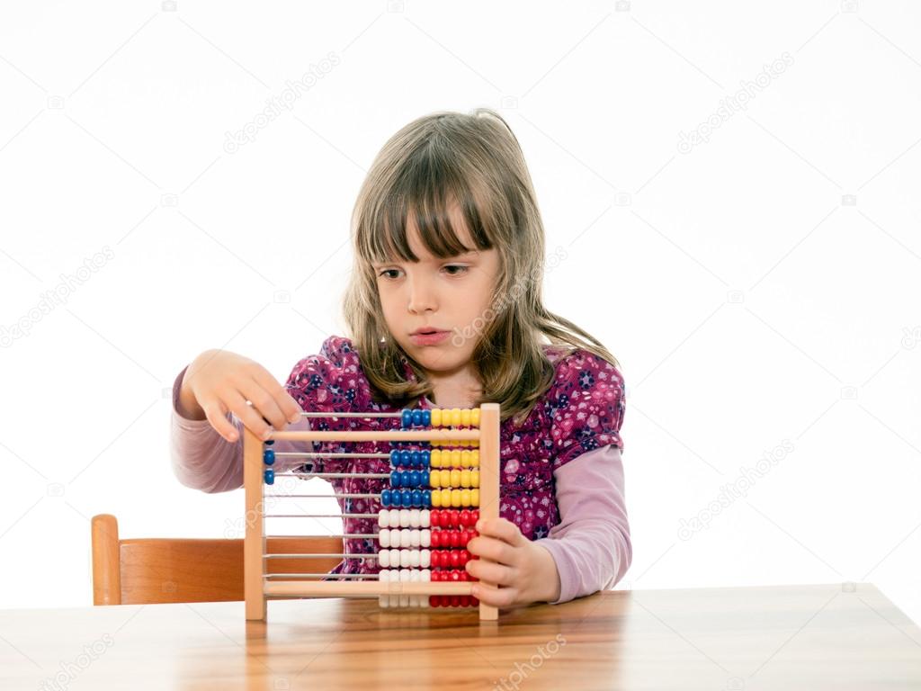 Child counts with abacus