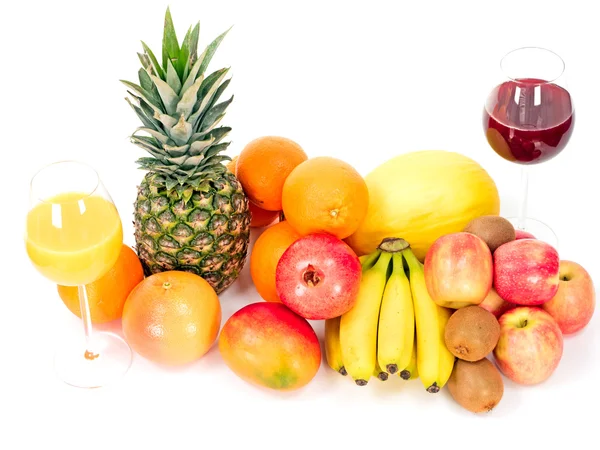 Frutas tropicales con zumos de frutas Imagen de archivo