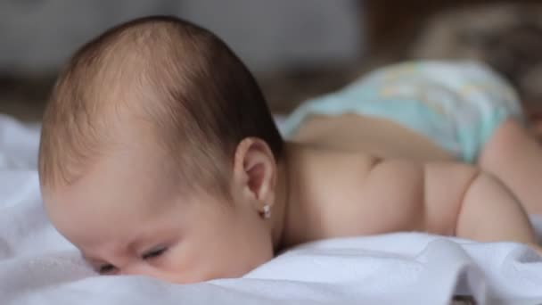 Little Baby is Crawling through Sheets — Stock Video