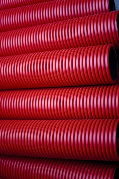 Red plastic pipes — Stock Photo, Image