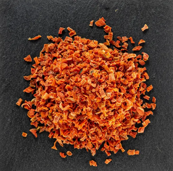 Chopped 100g bright carrots, macro photo — Stock Photo, Image