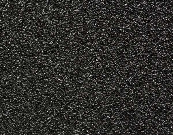 Black sandpaper texture macro — Stock Photo, Image