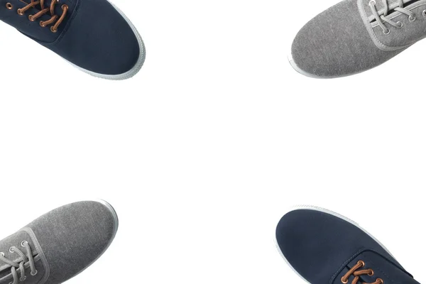 分离出的四个灰色和蓝色运动鞋 — 图库照片