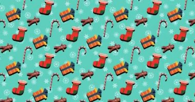 Noel tasarım elementleriyle birlikte 4k Noel hareketi arka planı. Yeni yıl 2021. Sevimli Noel sembollü animasyon. Şeker, hediye, şeker adam ve çorap. Kusursuz video. 