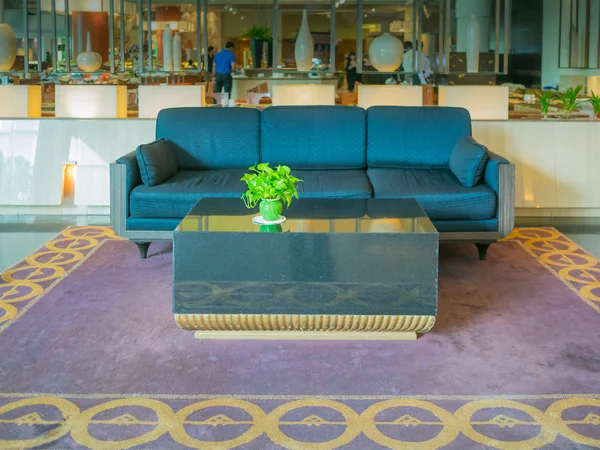 Blue sofa in hotel lobby — Stock Photo, Image