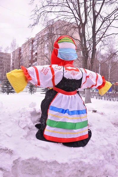 burning of effigies on the Russian traditional holiday Maslenitsa or Seeing off winter. a pot of porridge and butter and a bunch of mutton. Concept spring and festival