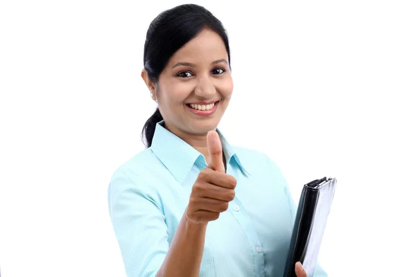Businesswoman with tablet and making thumbs up gesture — Stock Photo, Image