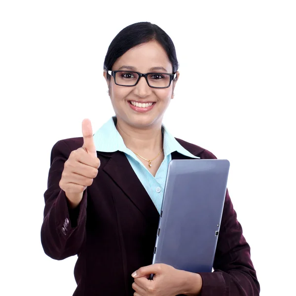 Businesswoman with tablet and making thumbs up gesture — Stock Photo, Image