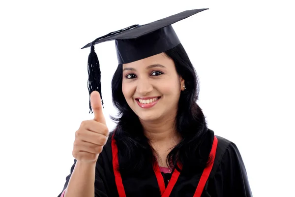 Smiling young graduation student making thumbsup gesture — Stok Foto