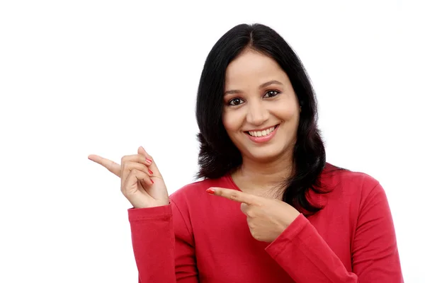 Smiling young woman showing isolated presentation — Stock Photo, Image