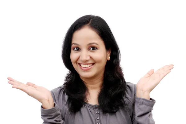 Surprised young woman against white background — Stock Photo, Image