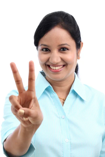 Young business woman making victory gesture — Stock Photo, Image