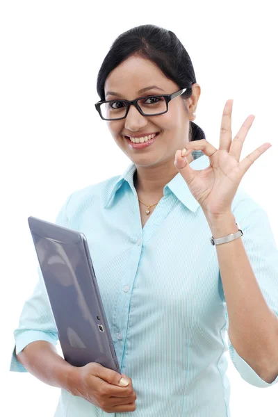 Young business woman with tablet and making OK gesture — Stock Photo, Image