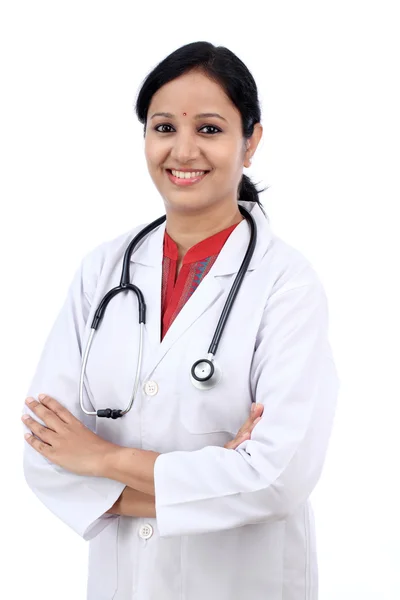 Young female doctor against white background — Stock Photo, Image