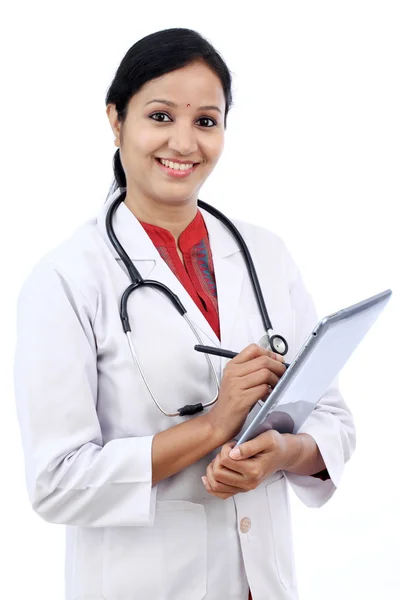 Young female doctor with tablet — Stock Photo, Image