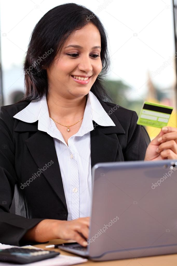 Young business woman doing online shopping