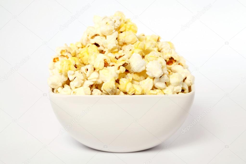 Bowl of popcorn on white