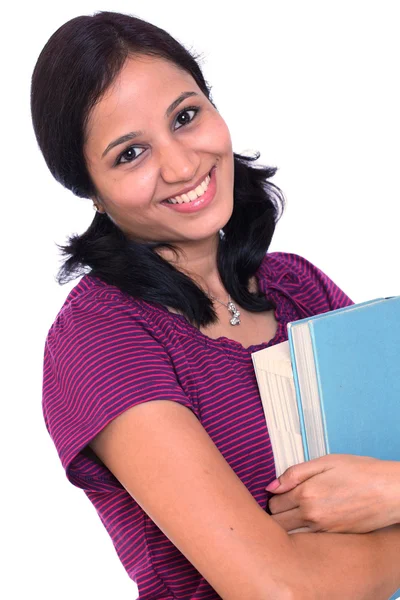Female student holding books in her hand — Stock Photo, Image