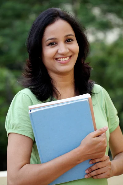 Happy young female student at college campus — Stock Photo, Image
