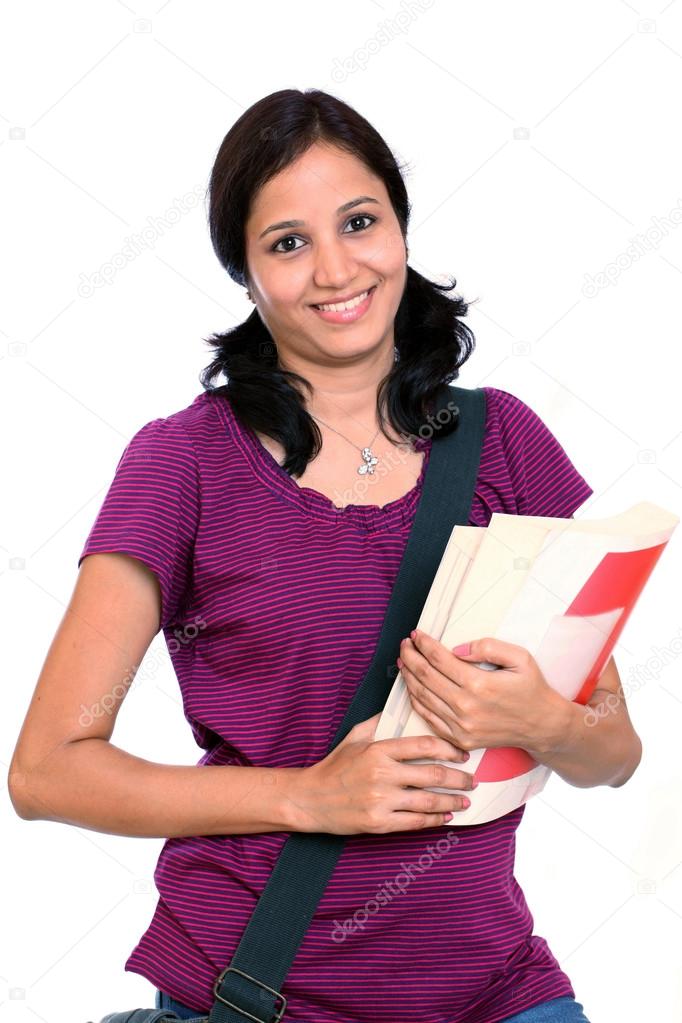 Young female student holding books