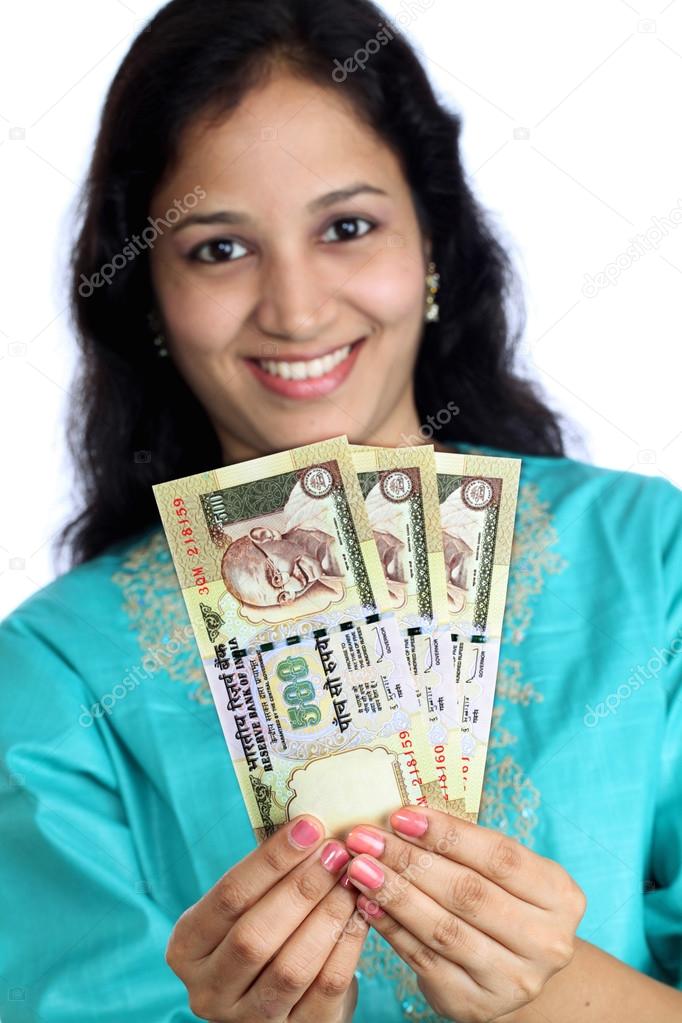 Young woman holding Indian currency