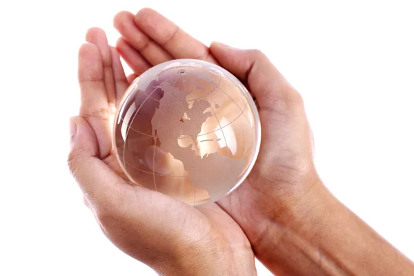Mani che tengono un globo di vetro — Foto Stock