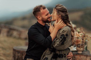 A happy couple hugging and smiling spending time at their intimate wedding