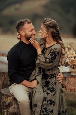 A happy couple hugging and smiling spending time at their intimate wedding