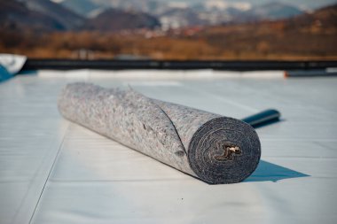 Geotextile for roof, covered with synthetic PVC membrane clipart