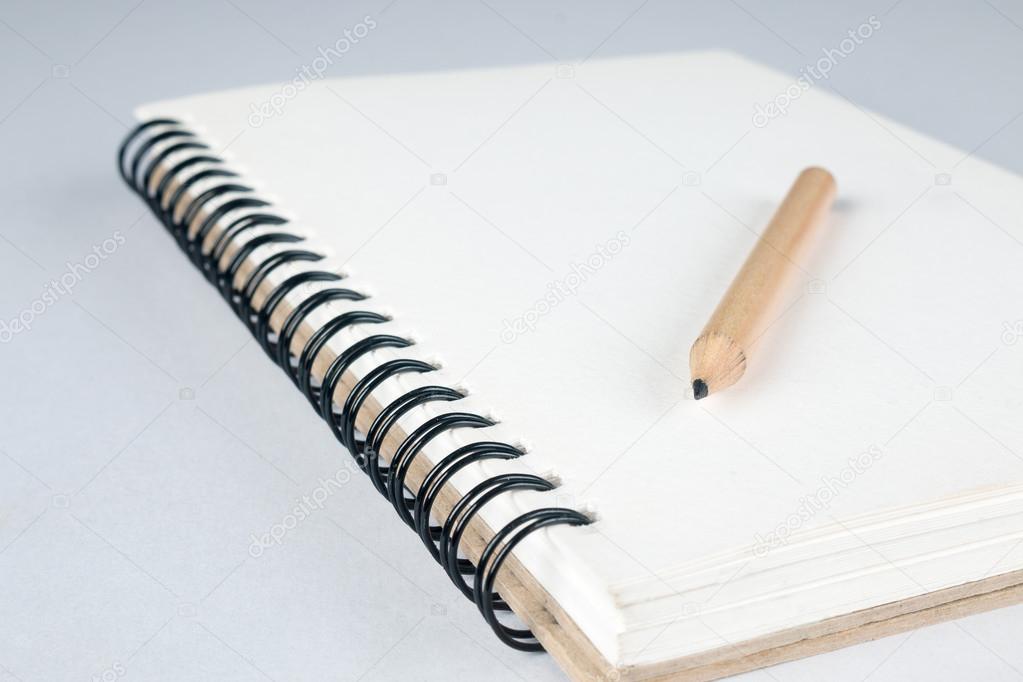 sketch book with pencil