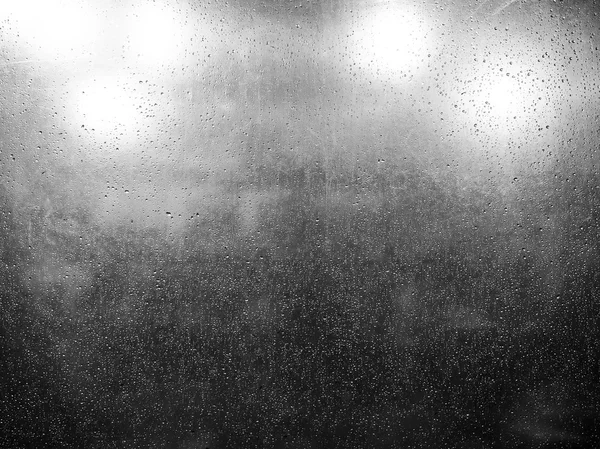 Goccia di pioggia su foglio di plastica trasparente — Foto Stock