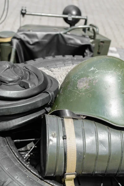 Old military helmet. Detail with old military helmet placed over