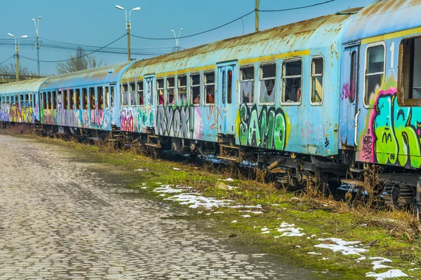 Abandoned train wagons vandalized near Grand Bridge. — Stock Photo, Image