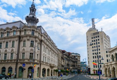 BUCHAREST, ROMANIA - June 28, 2015. Grand Hotel Continental from Victoria Avenue (Calea Victoriei) with Post Palace on background