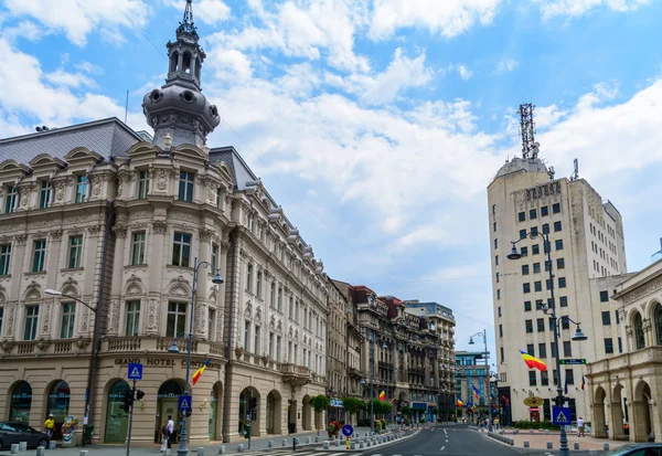 BUCHAREST, ROMANIA - June 28, 2015. Grand Hotel Continental from Victoria Avenue (Calea Victoriei) with Post Palace on background — Stock Photo, Image