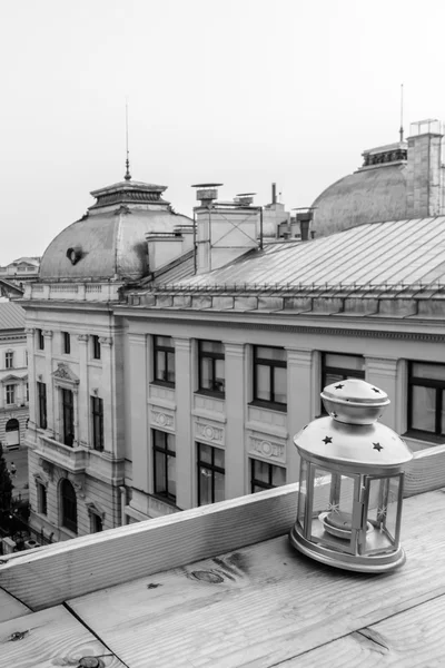 Roof-top view of a lantern over a small square. Vertical black a — Stock Photo, Image