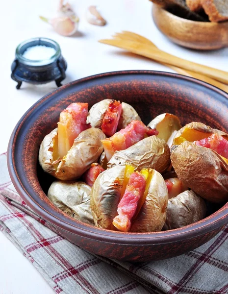 Baked potato with bacon, rustic style — Stock Photo, Image