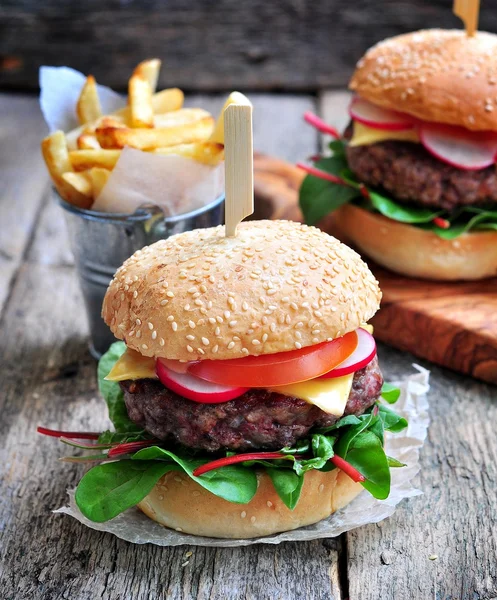 Homemade beef burger with vegetables and french fries. — Stock Photo, Image