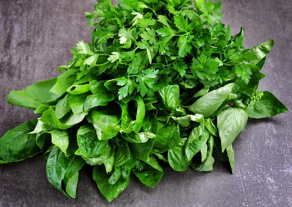 Organic basil and parsley on a granite background. — Stock Photo, Image