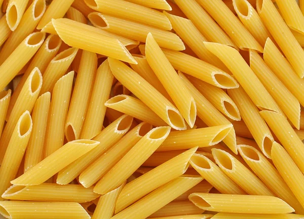 Blandade rå pasta bakgrund — Stockfoto