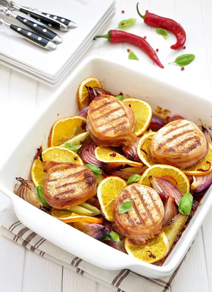 Grilled meat on the baked vegetables and orange — Stock Photo, Image