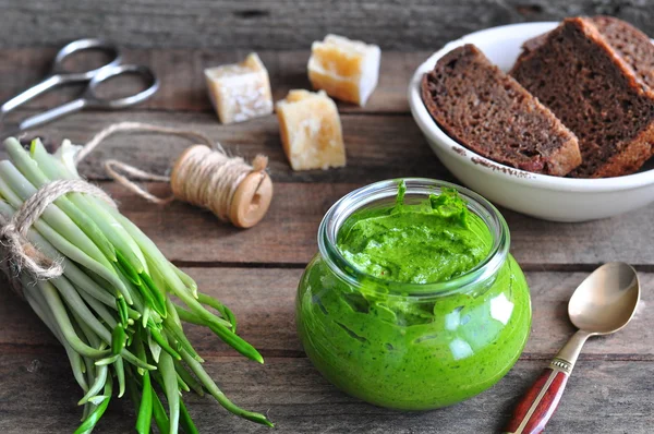 Ramson and sauce pesto on a wooden table — Stock Photo, Image