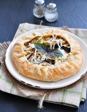 Galette pie with grilled vegetables and provolone cheese