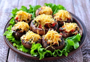 mushrooms stuffed with vegetables and bacon, baked with cheese