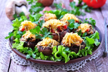 mushrooms stuffed with vegetables and bacon, baked with cheese