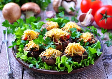 mushrooms stuffed with vegetables and bacon, baked with cheese