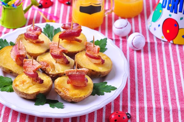 Baked potato with bacon "boats" for children's parties — Stock Image Baked potato with bacon "boats" for children's parties Stock Photo