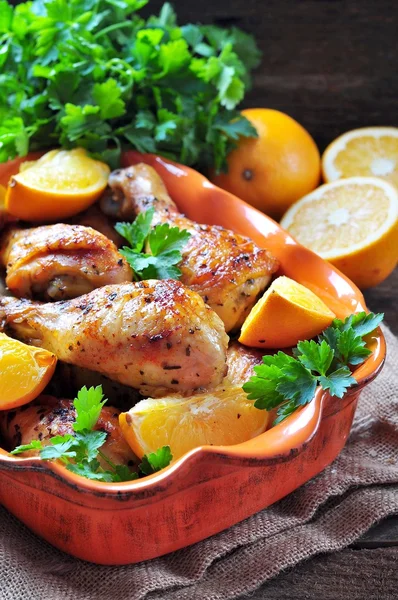 Baked chicken drumstick with orange, smoked paprika, Provencal herbs and olive oil. — Stockfoto
